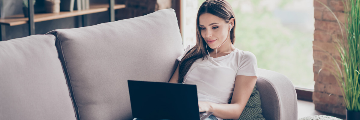 Woman downloading resources using laptop